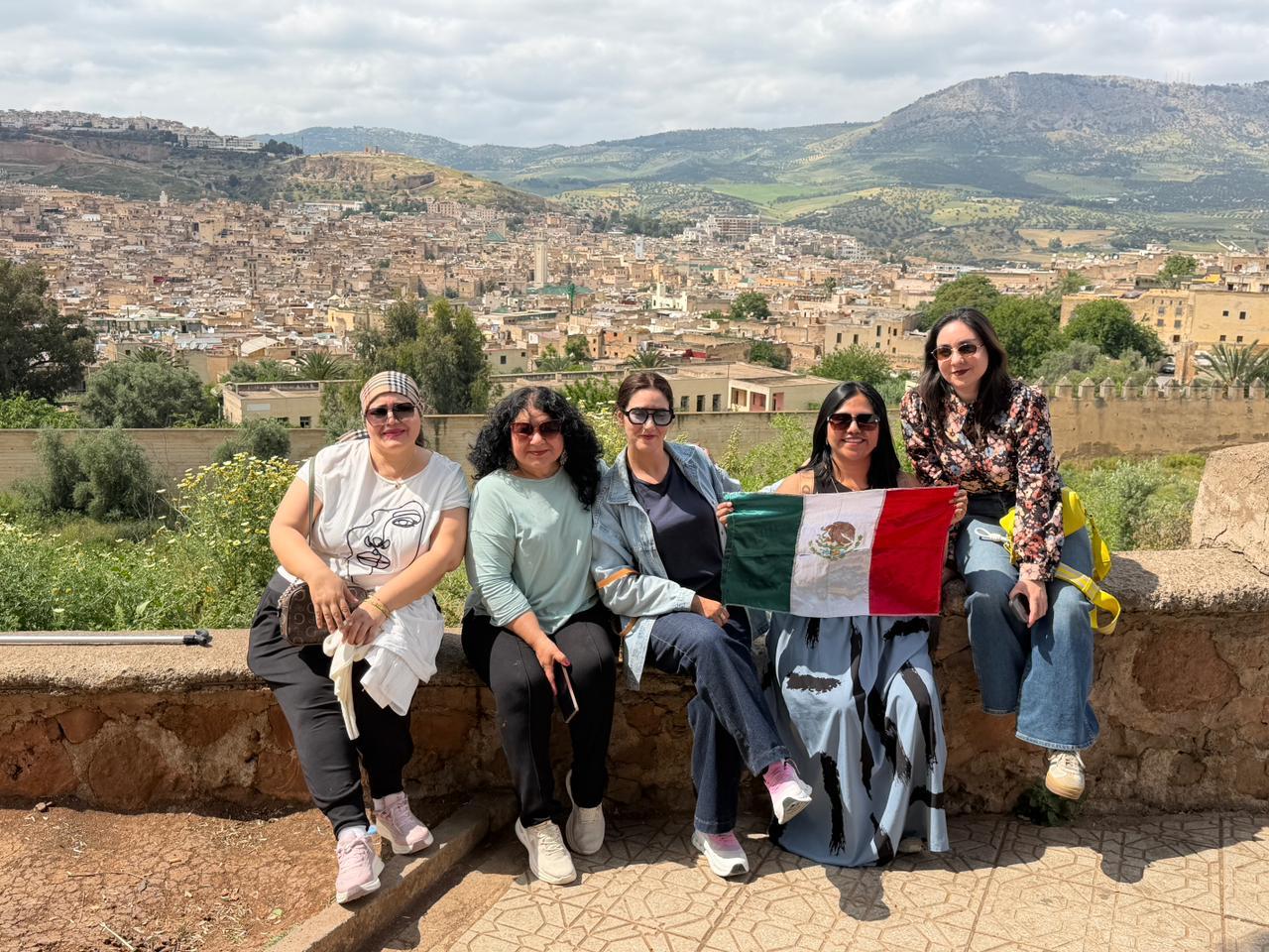 Licensed Tour Guide Youssra Sayouri Leading a Group Tour in Fes, Morocco
